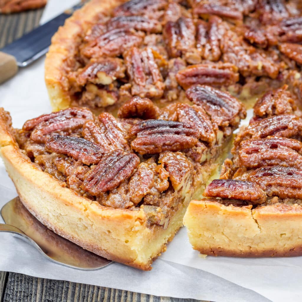 Freshly Baked Pecan Pie Sliced on a Parchment Paper