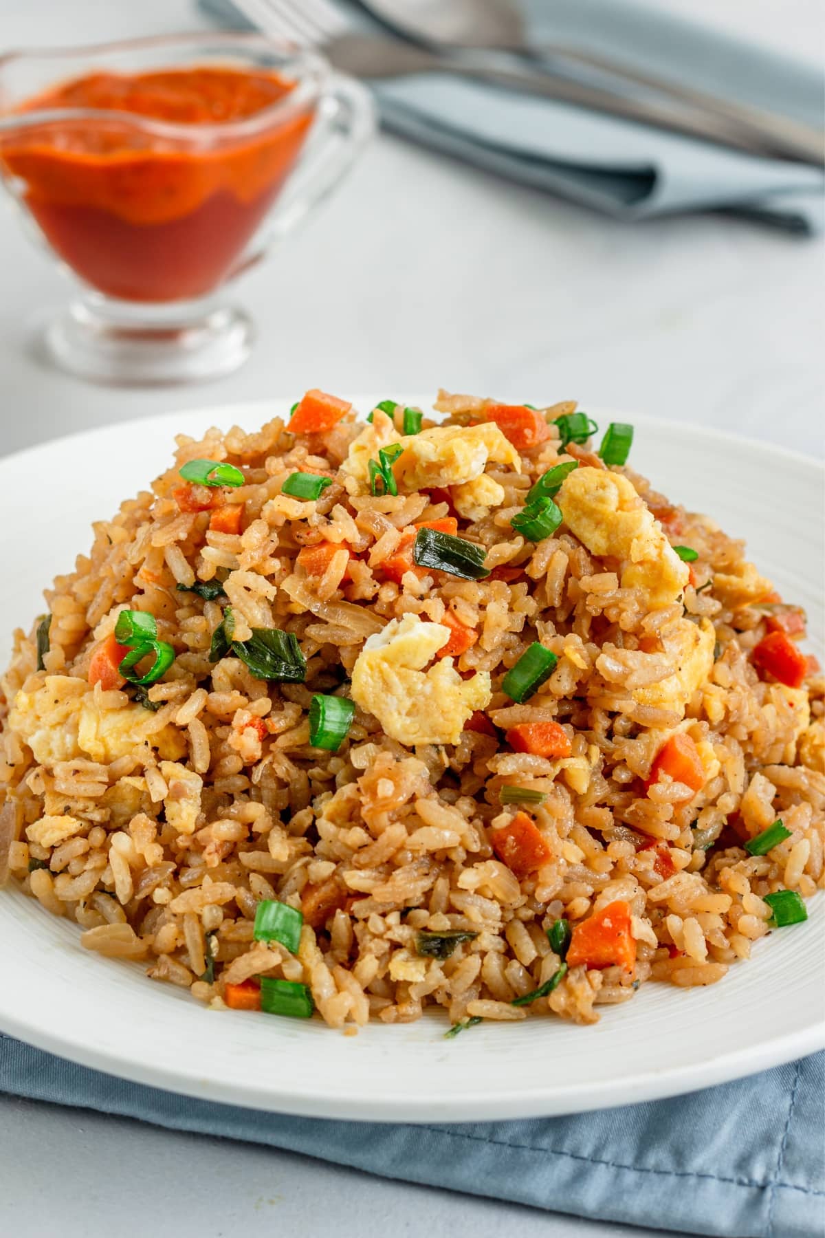 Platter of Panda Express Fried Rice with egg, carrots and sliced green onions