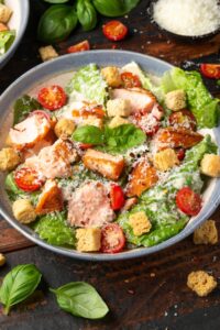 Salmon Caesar Salad with Croutons and Cherry Tomatoes