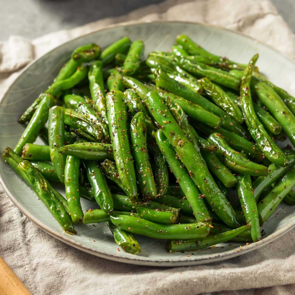 Dish of Green Beans Steamed in the Microwave, seasoned with Salt and Cracked Black Pepper