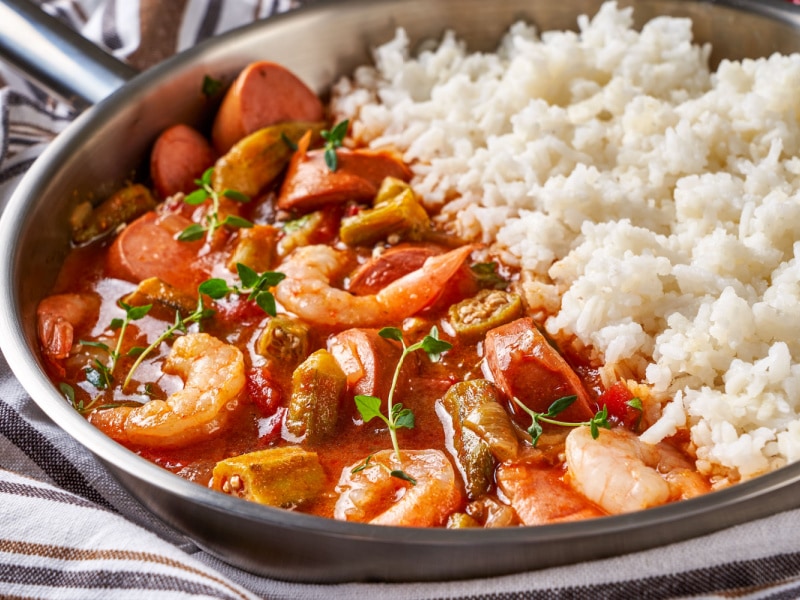 Seafood Gumbo with Sausage and Shrimps on a Pan with Rice