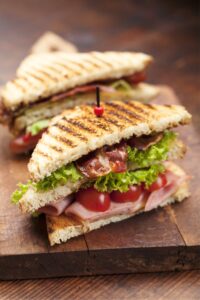 Slice of Ham and Bacon Sandwich with Tomatoes and Lettuce