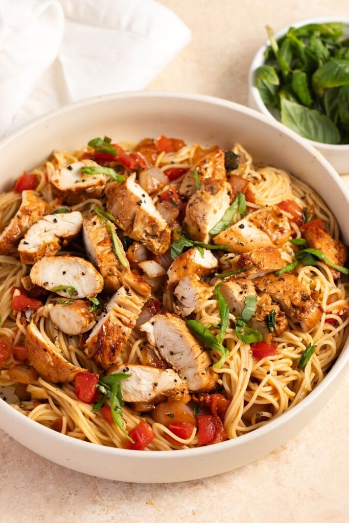 Delicious bruschetta chicken pasta with tomatoes and herbs