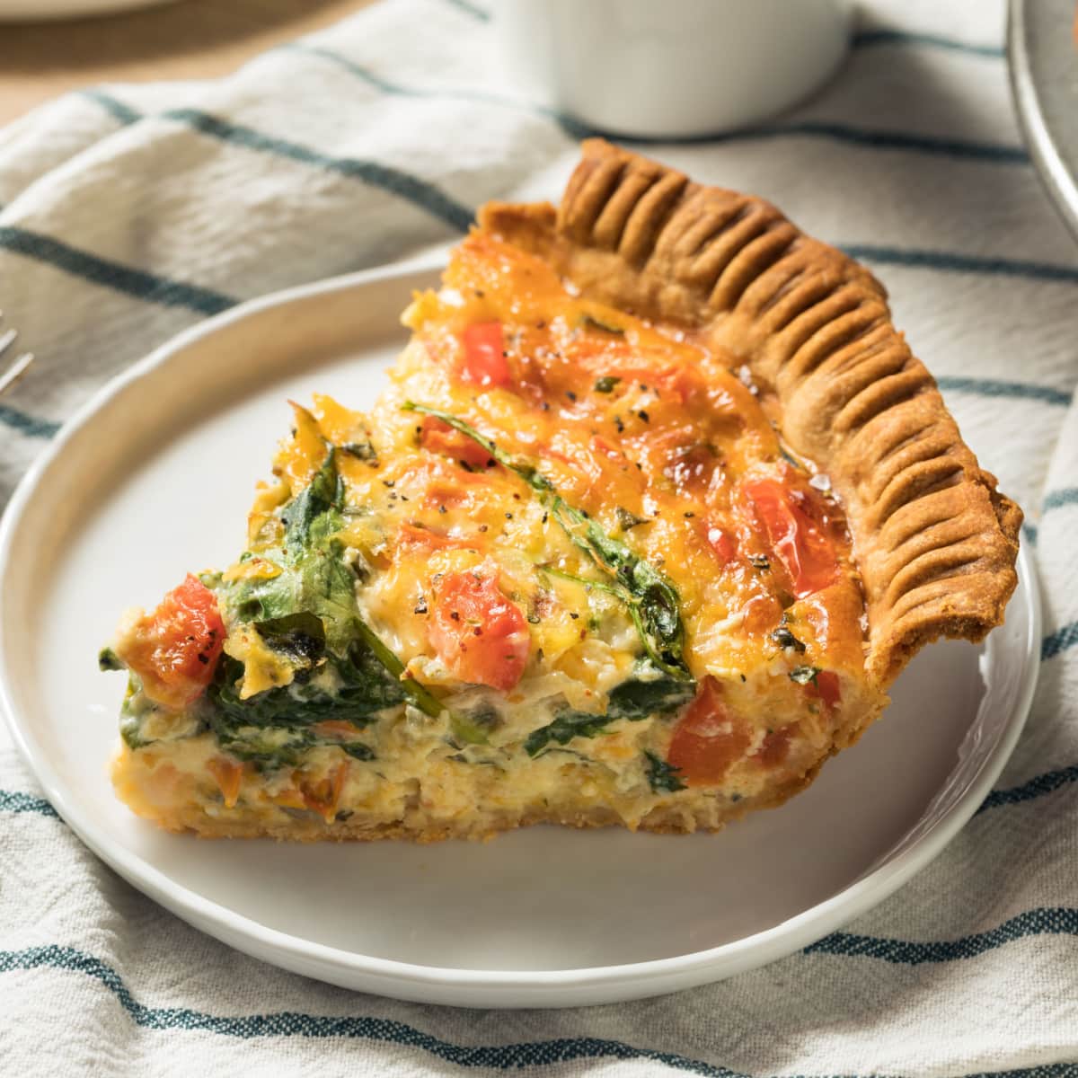 Healthy Veggie Quiche for Breakfast with Spinach and Tomato