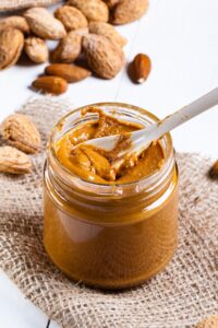 A Jar of Homemade Almond Butter with Nuts