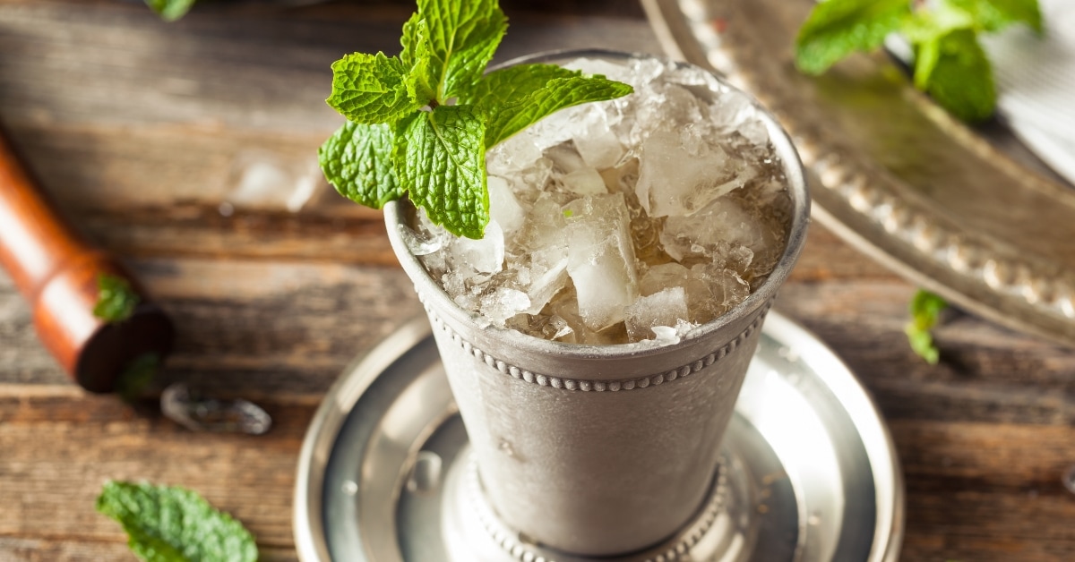 Homemade Boozy Iced Cold Mint Julep in a Stainless Glass