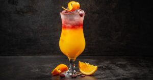 Homemade Sex on the Beach Cocktail Topped with Orange Rind