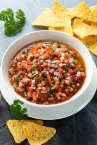 Bowl of Salsa with Onions, Tomatoes and Nachos