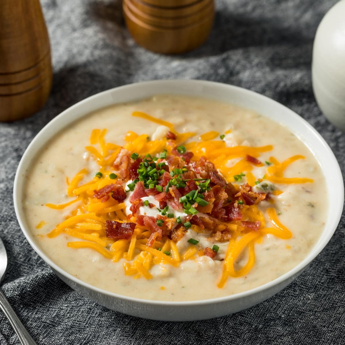 Crockpot Potato Soup, Topped With Cheese, Bacon Bits and Sour Cream