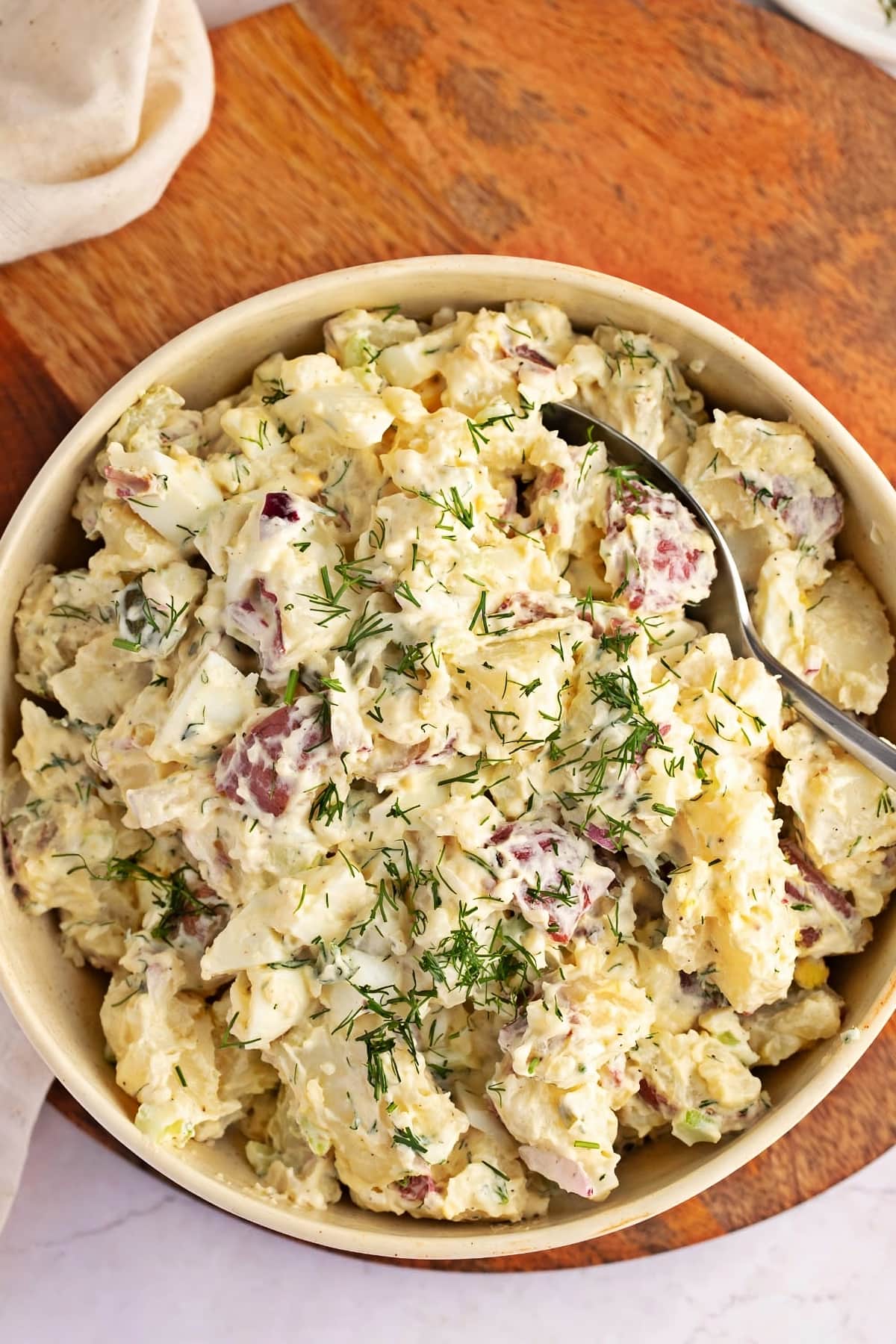 Bowl of Homemade Red Potato Salad with Fresh Rosemary on Top