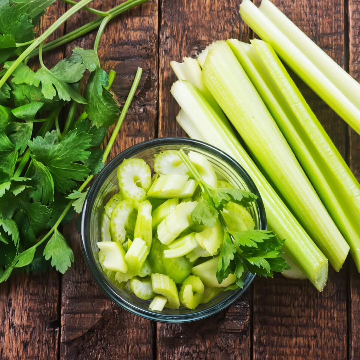 Bowl of Fresh Celery on a Wooden Background