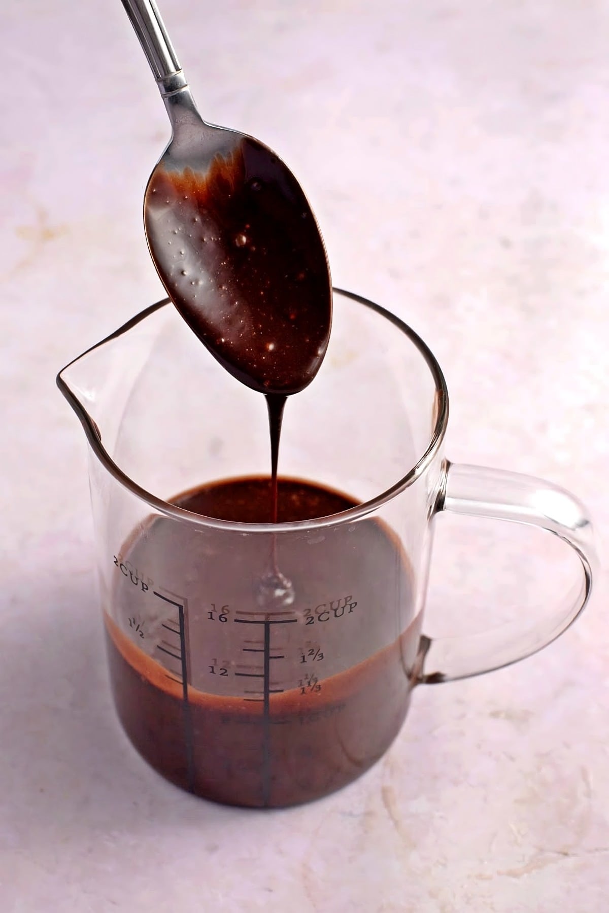 Chocolate Glaze in a Measuring Glass Container