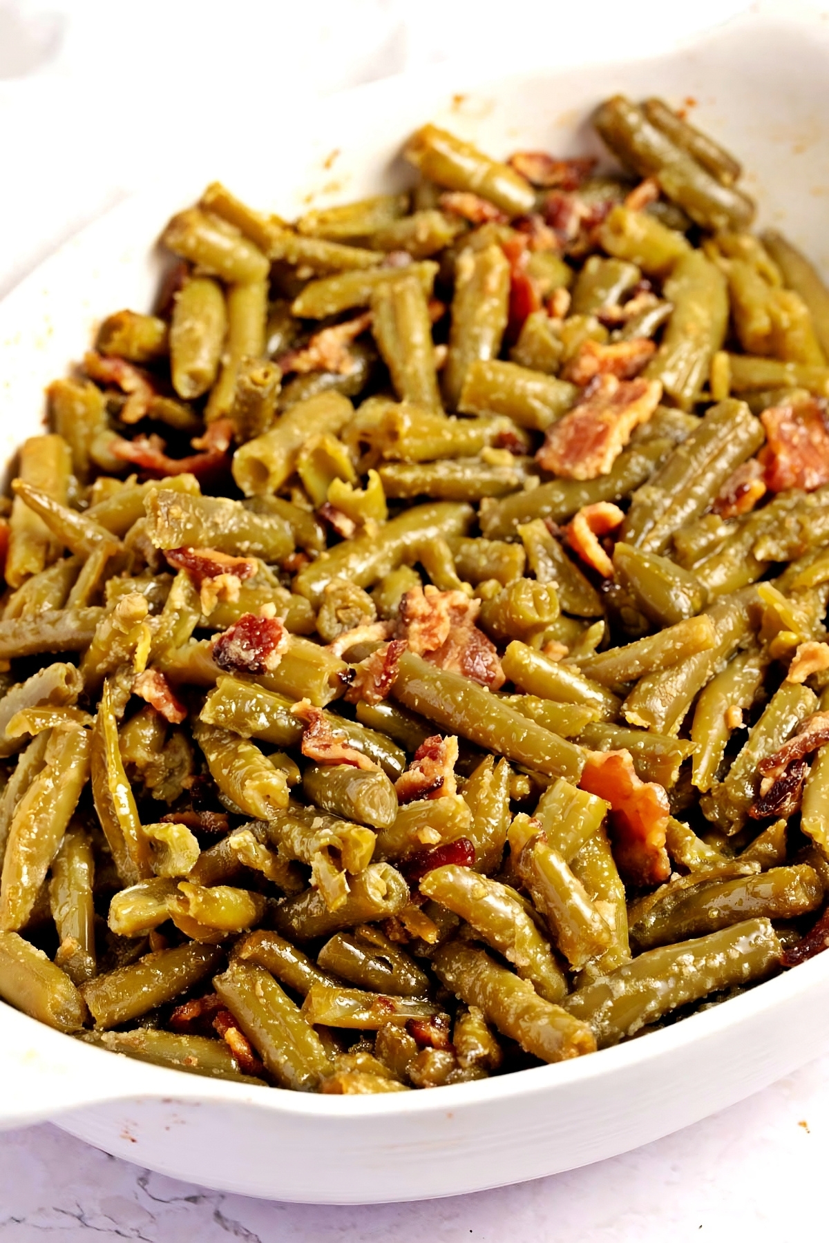 Crack Green Beans with Butter, Seasonings, and Crispy Bacon in a Baking Dish