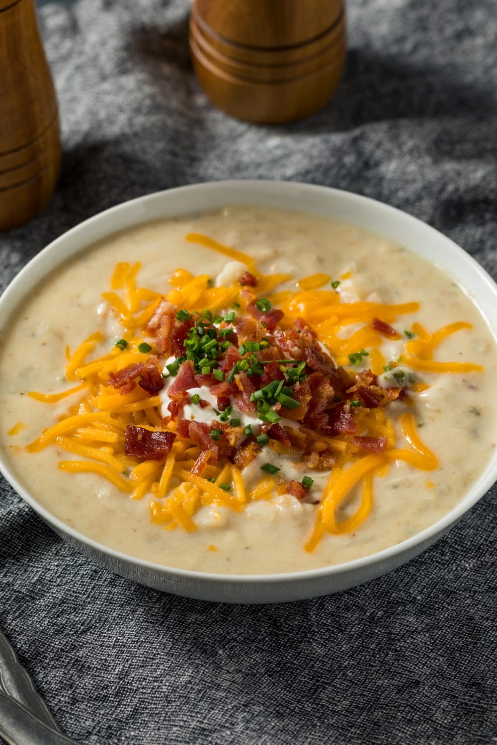Bowl of Crockpot Potato Soup, Loaded With Toppings
