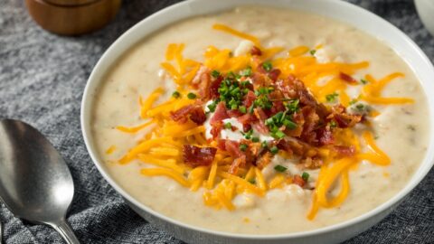 Homemade Crockpot Potato Soup Topped with Cheese, Bacon and Green Onions