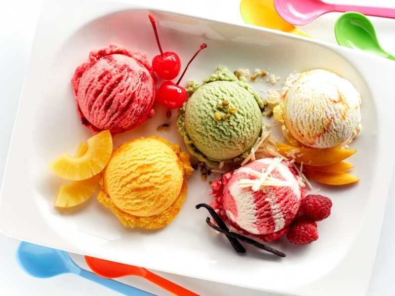 Different Ice Cream Flavors with Pineapple, Raspberry, Peach, Cherry, and Pistachio Plus Fresh Garnishes o Each Flavor