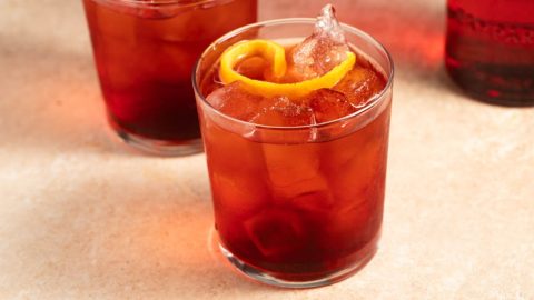 Negroni Sbagliato in a cold glass on a marble table