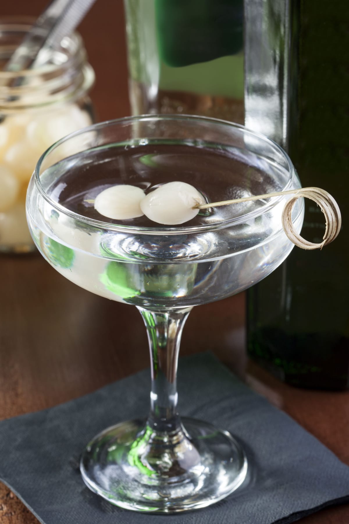 Gibson Cocktail Recipe (An Easy Classic) featuring Gibson Cocktail on a Tall Glass Garnished with Cocktail Onions