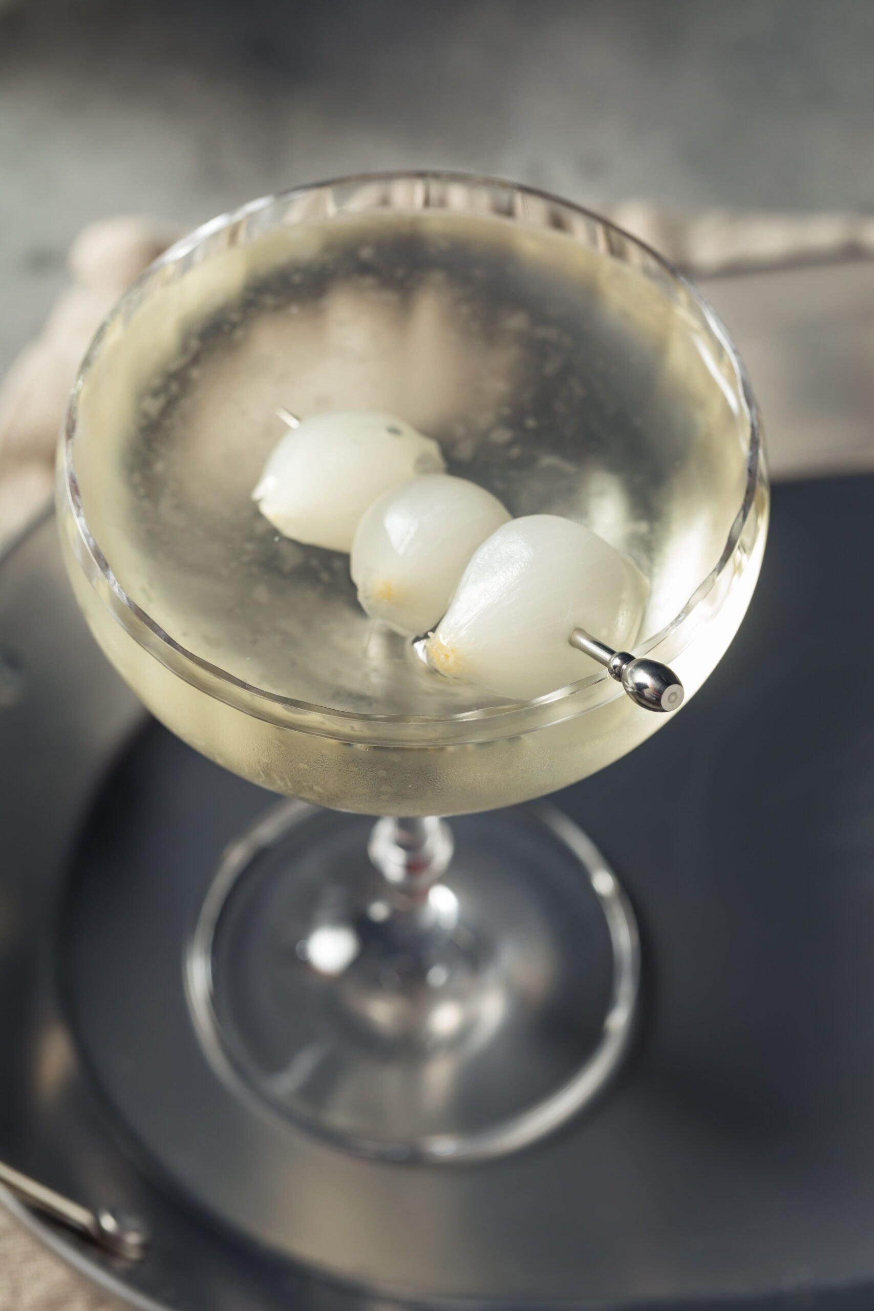 Close Up of a Gibson Cocktail in Glass with Cocktail Onions