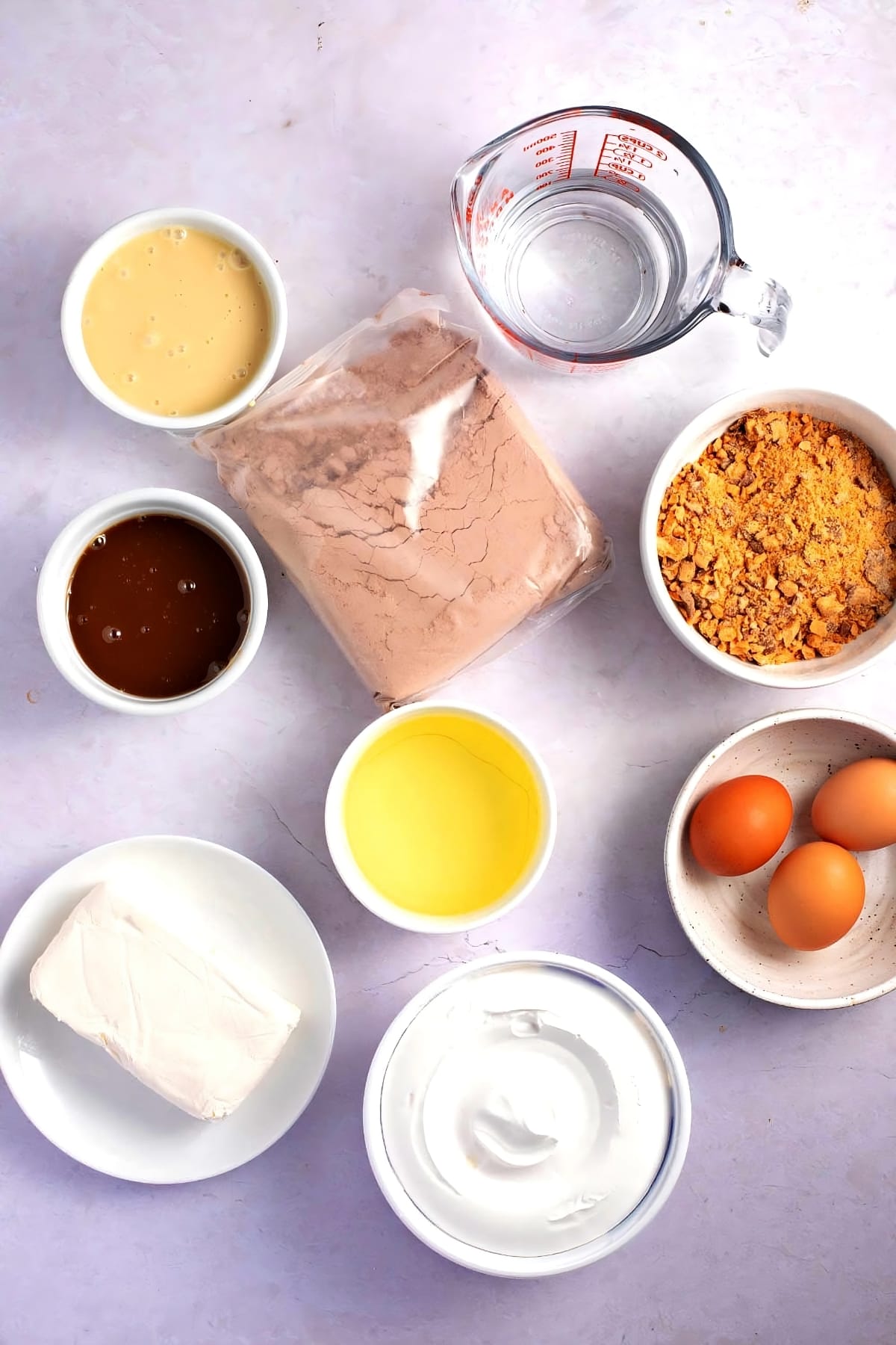 Holy Cow Cake Ingredients - Cake Mix, Eggs, Caramel, Condensed Milk, Butterfinger Candy Bar, Whipped Topping and Cream Cheese