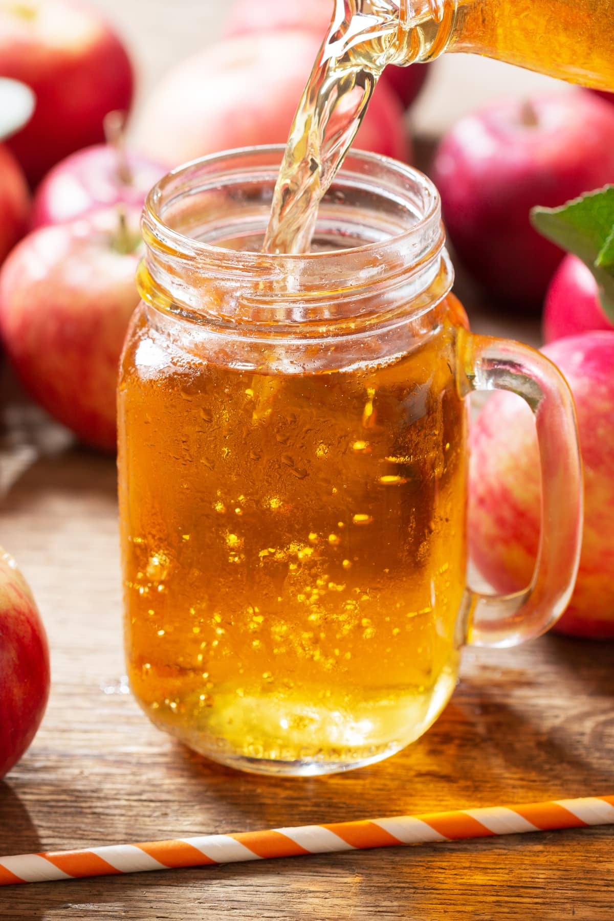 Homemade Apple Juice in a Glass Jar with Fresh Apples