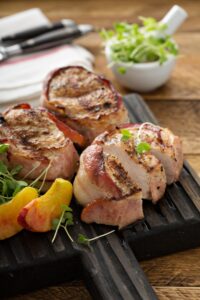 Homemade Bacon Wrapped Turkey Tenderloin Served with Fresh Peaches