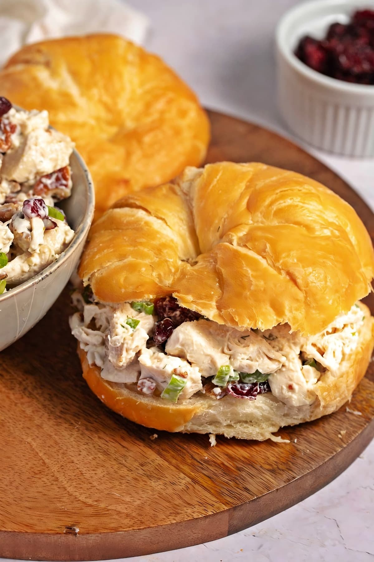 Bread Sandwich with salad filling made with chicken, mayonnaise, green onions, dried cranberries, chopped pecans, lime juice, and dried dill weed.