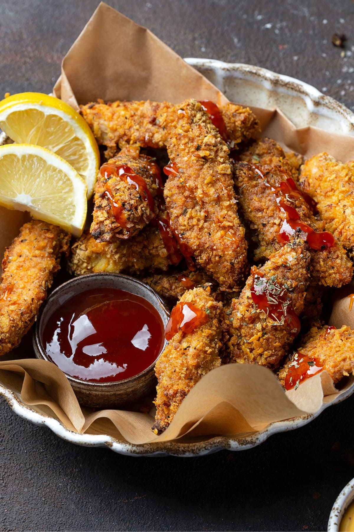 Homemade Chicken Strips with Ketchup and Lemons