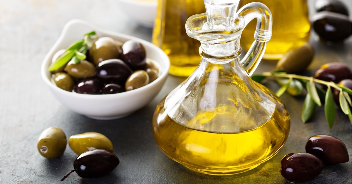 Homemade Olive Oil in Bottles with Green and Black Olives