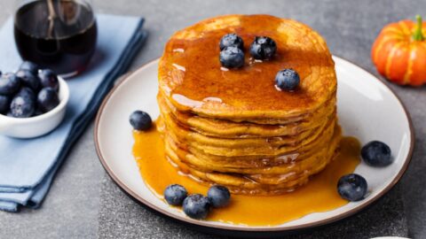 Pumpkin pancakes drizzled with syrup