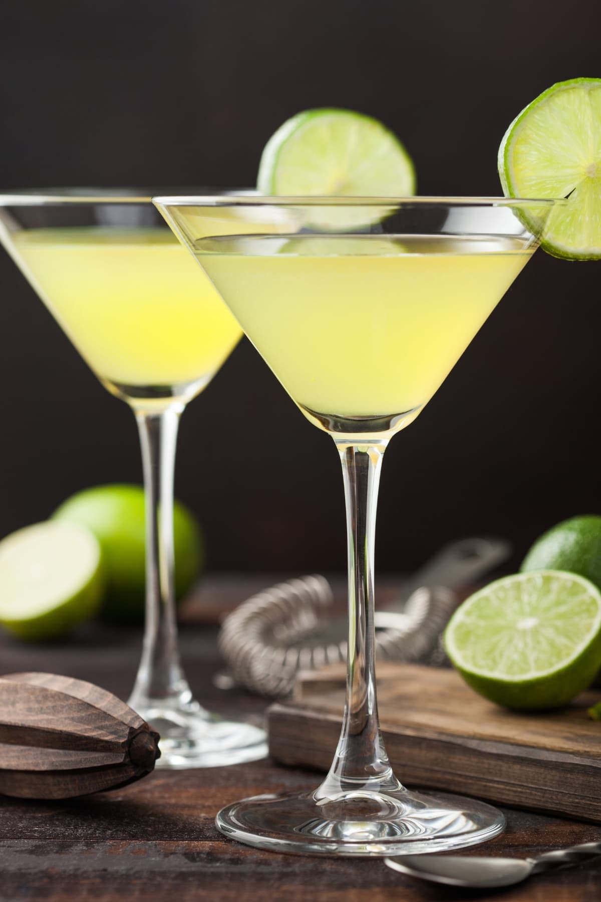 Two Glasses of Key Lime Martini in a Wooden Table