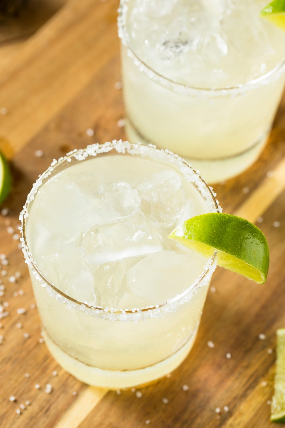 Classic Margarita on the rocks with a salted rim and lime wedge garnish