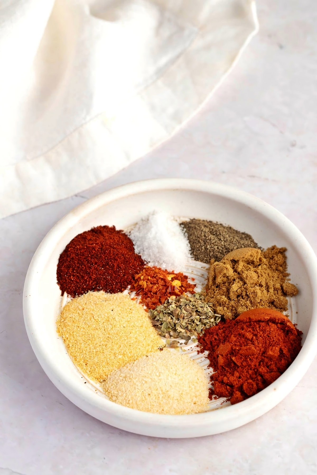Mexican Seasoning Ingredients - Chili, Garlic and Onion Powder, Crushed Red Pepper Flakes, Dried Oregano, Paprika, Ground Cumin, Cinnamon and Ground Cloves