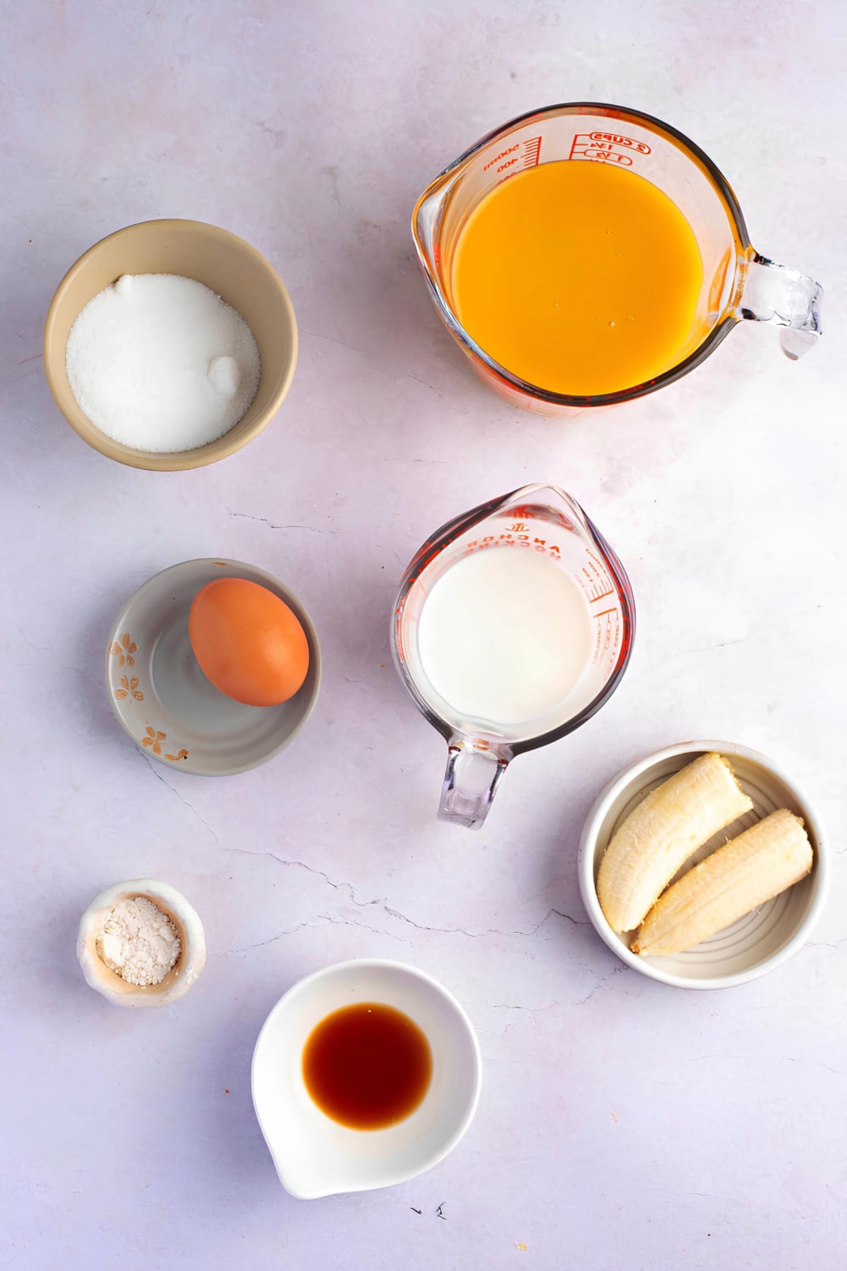Orange Julius Ingredients - Ice Cubes, Orange Juice Concentrate, Milk, Whipping Cream, Banana, Sugar, Eggs, Powdered Dairy Creamer, Vanilla Extract