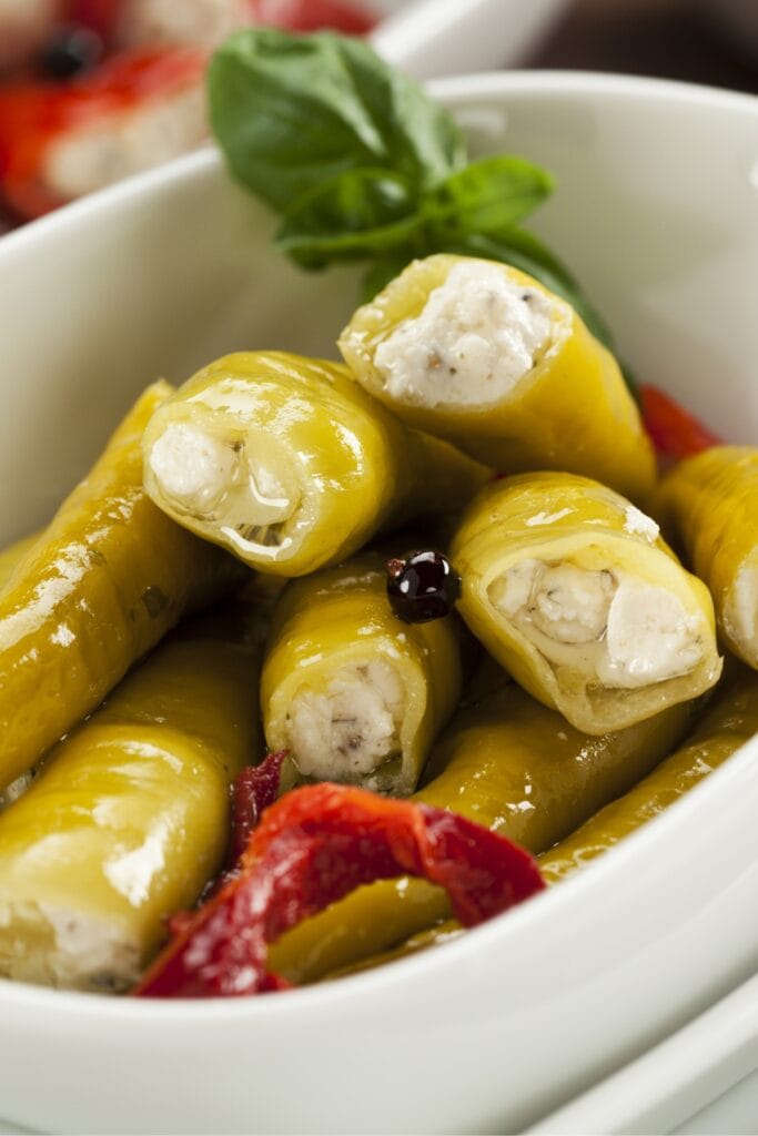 What Is Pepperoncini? All You Need To Know featuring Pepperoncini Stuffed with Cheese in a Bowl