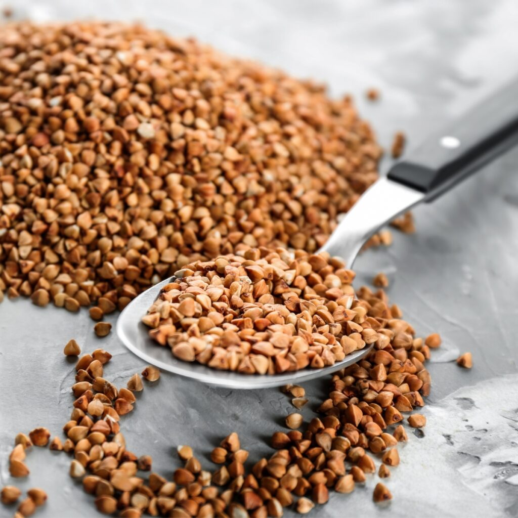 Raw Buckwheat Grains in a Spoon