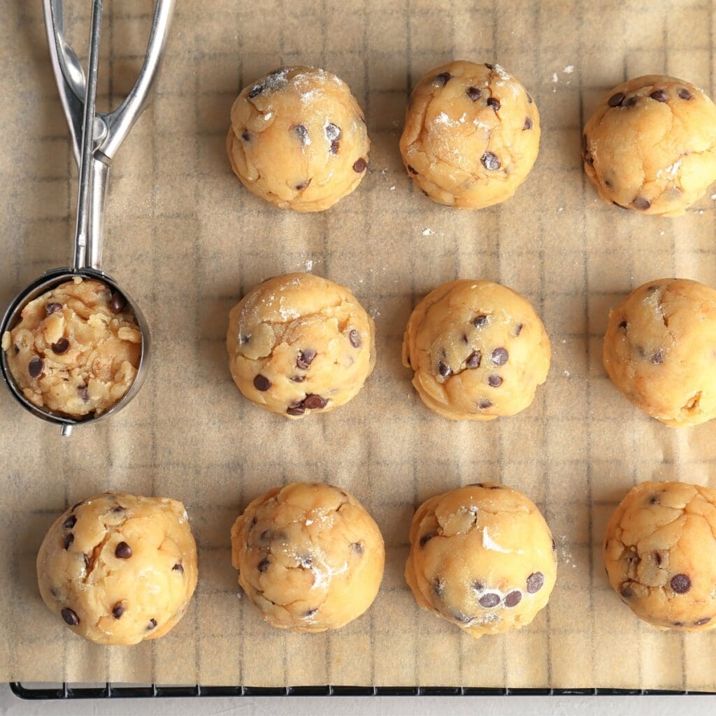 Raw Cookie Dough with Chocolate Chips on a Parchment Paper