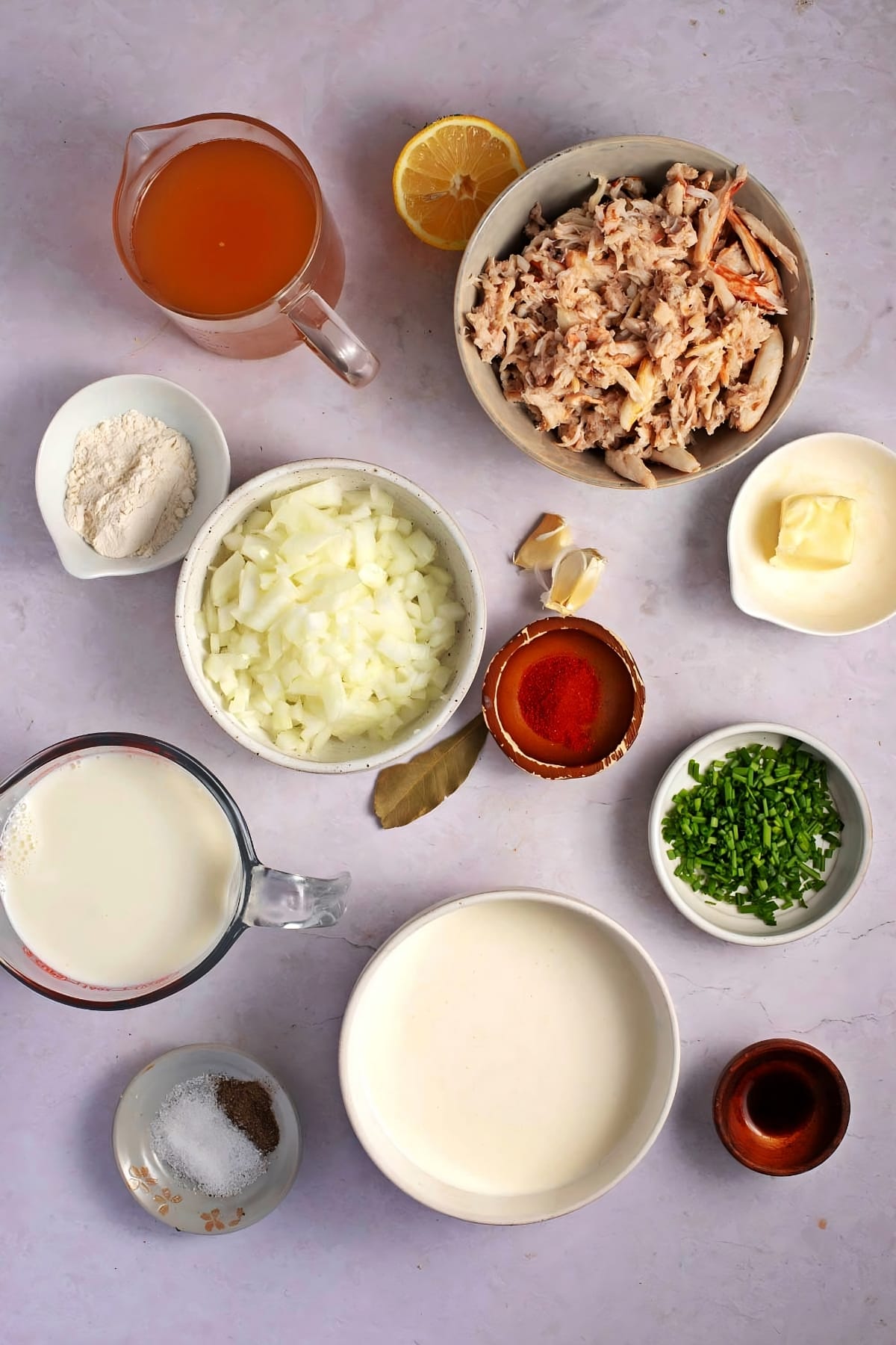 She Crab Soup Ingredients - Crab Meat, Crab Roe, Garlic Onion, Bay Leaf, Wine, Butter, Crab Stock, Milk & Heavy Cream, Paprika, Lemon Juice, Salt, Pepper and Chives
