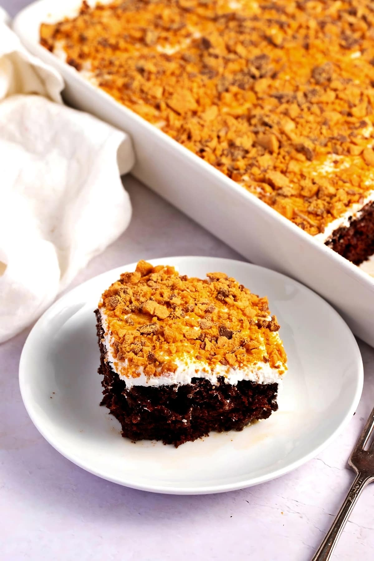 Sliced Homemade Holy Cow Cake with Crunchy Butterfinger Bar
