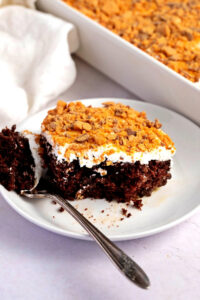 Sweet and Crunchy Holy Cow Cake Topped with Butterfinger Bars