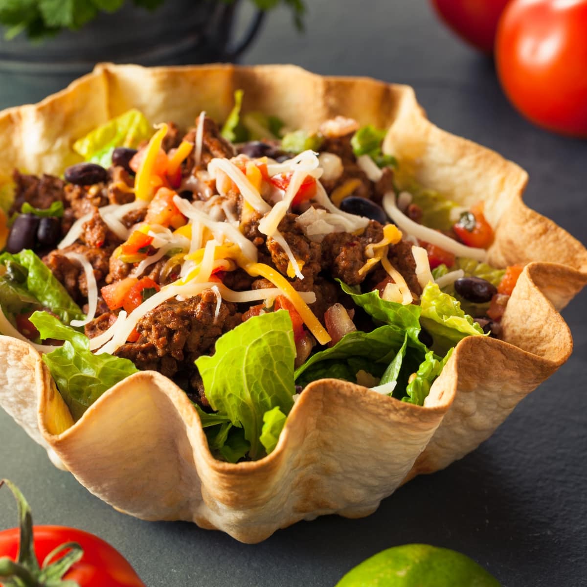 Taco Salad in a Tortilla Bowl with Beef Cheese and Lettuce
