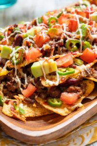 Tasty Nachos with Avocados, Ground Beef, Pepper and Tomatoes