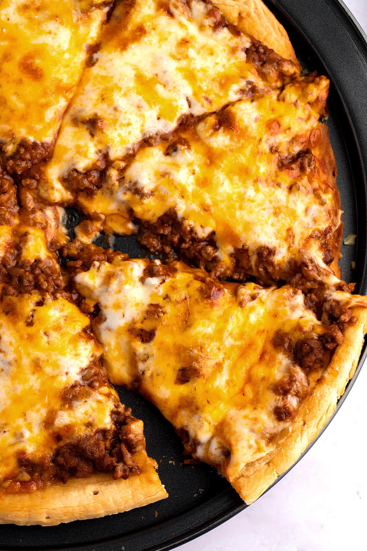 A Close Up of Sloppy Joe Pizza with Ground Beef and Cheese