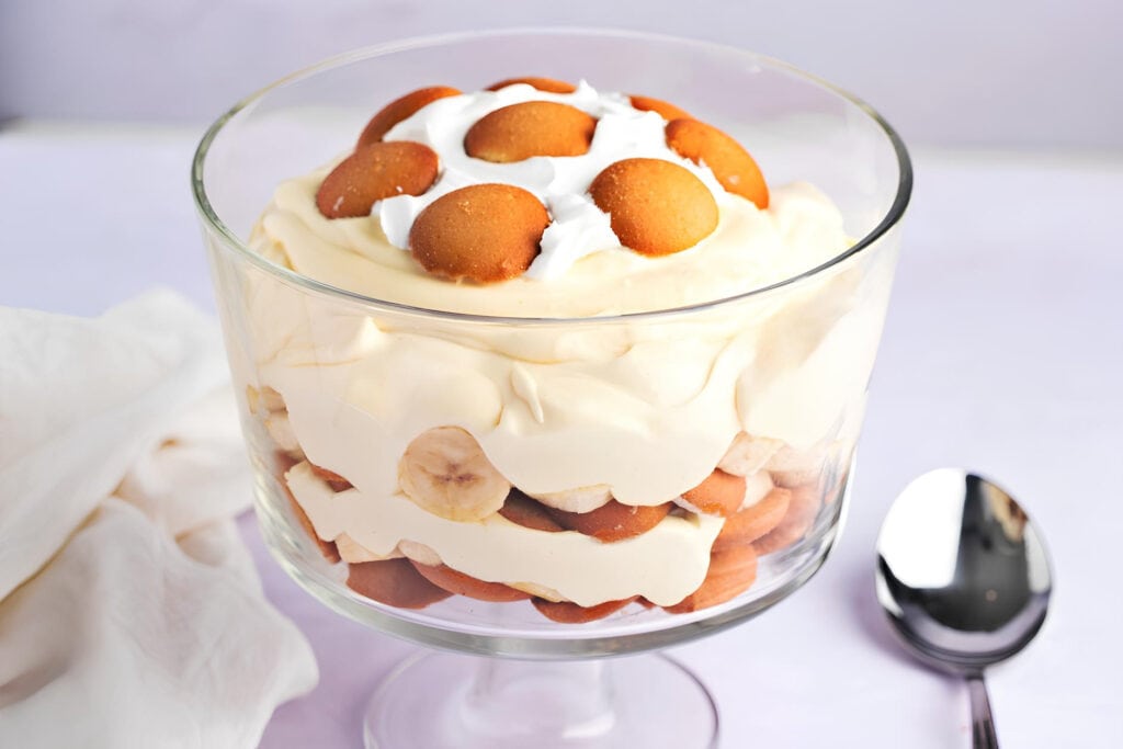 A Glass of Banana Pudding with Wafers and Whipped Cream