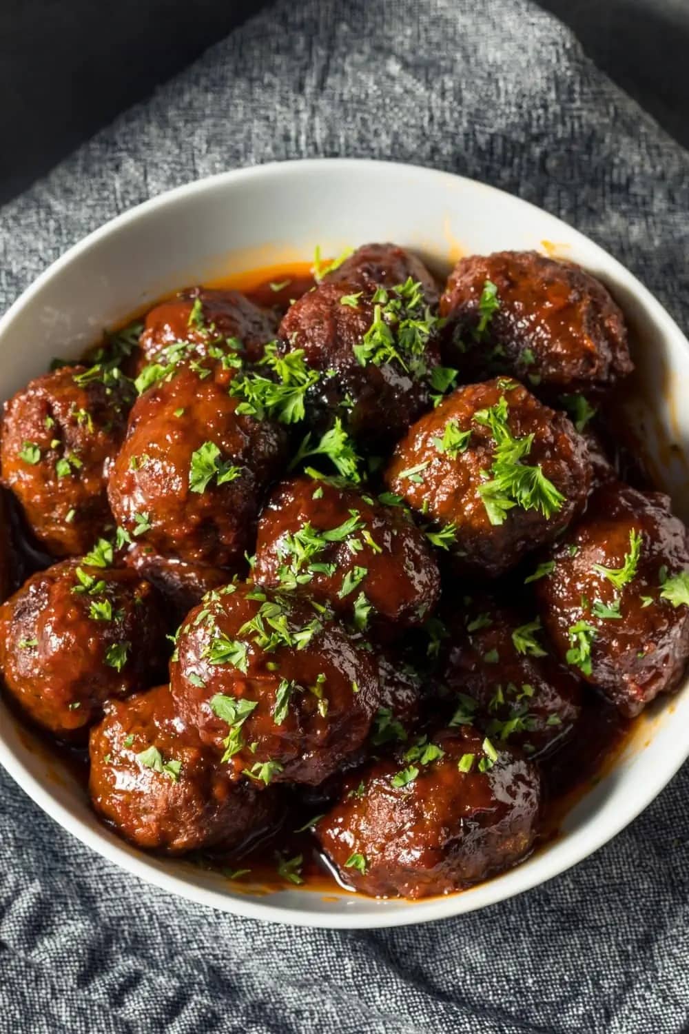 Bowl of homemade Air Fryer Meatballs garnished with chopped parsley