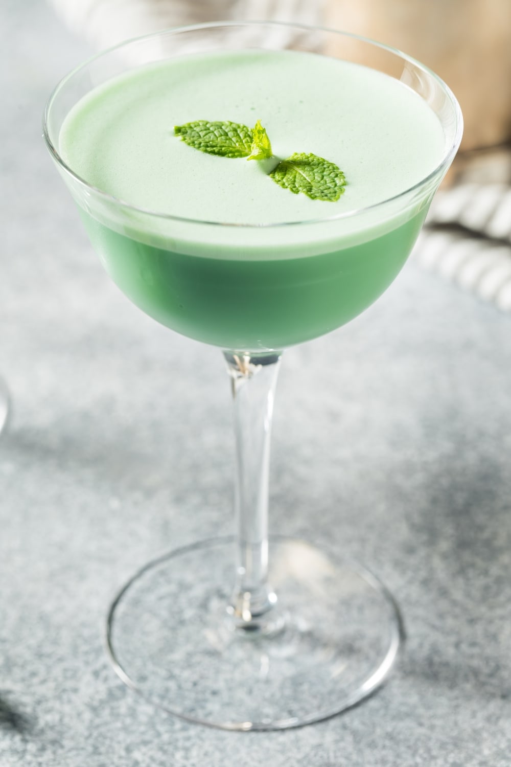Grasshopper Cocktail on a Glass Garnished With Fresh Mint Leaves