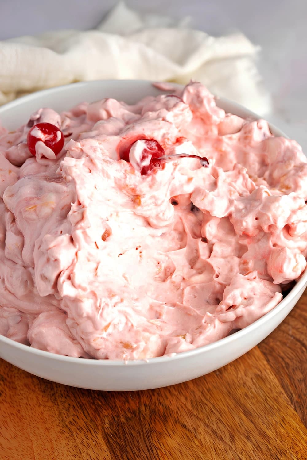 Bowl of Cherry Fluff on a Wooden Board