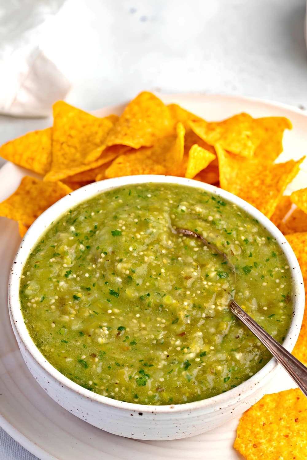 Bowl of Salsa Verde and Nachos on a Plate