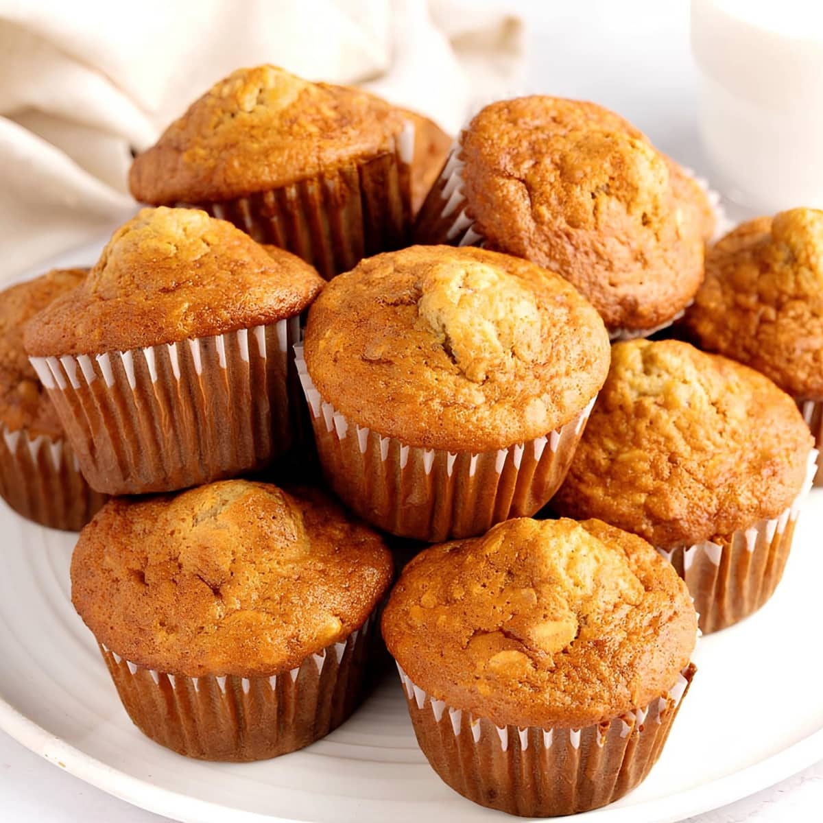 Bunch of Banana Oat Muffins on a Round Plate