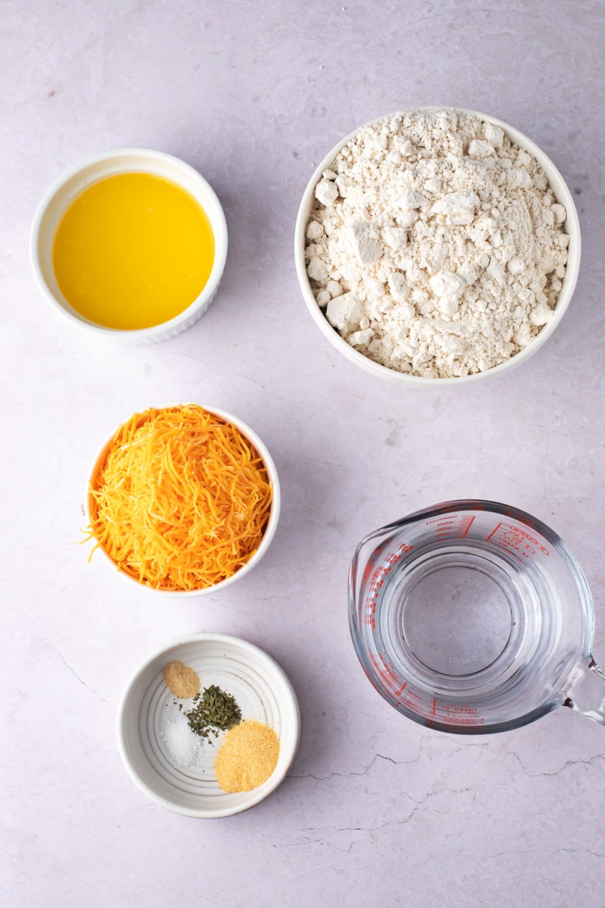 Cheddar Bay Biscuits Ingredients - Baking Mix, Cheddar Cheese, Water, Butter, Garlic Powder, Salt, Onion Powder and Dried Parsley
